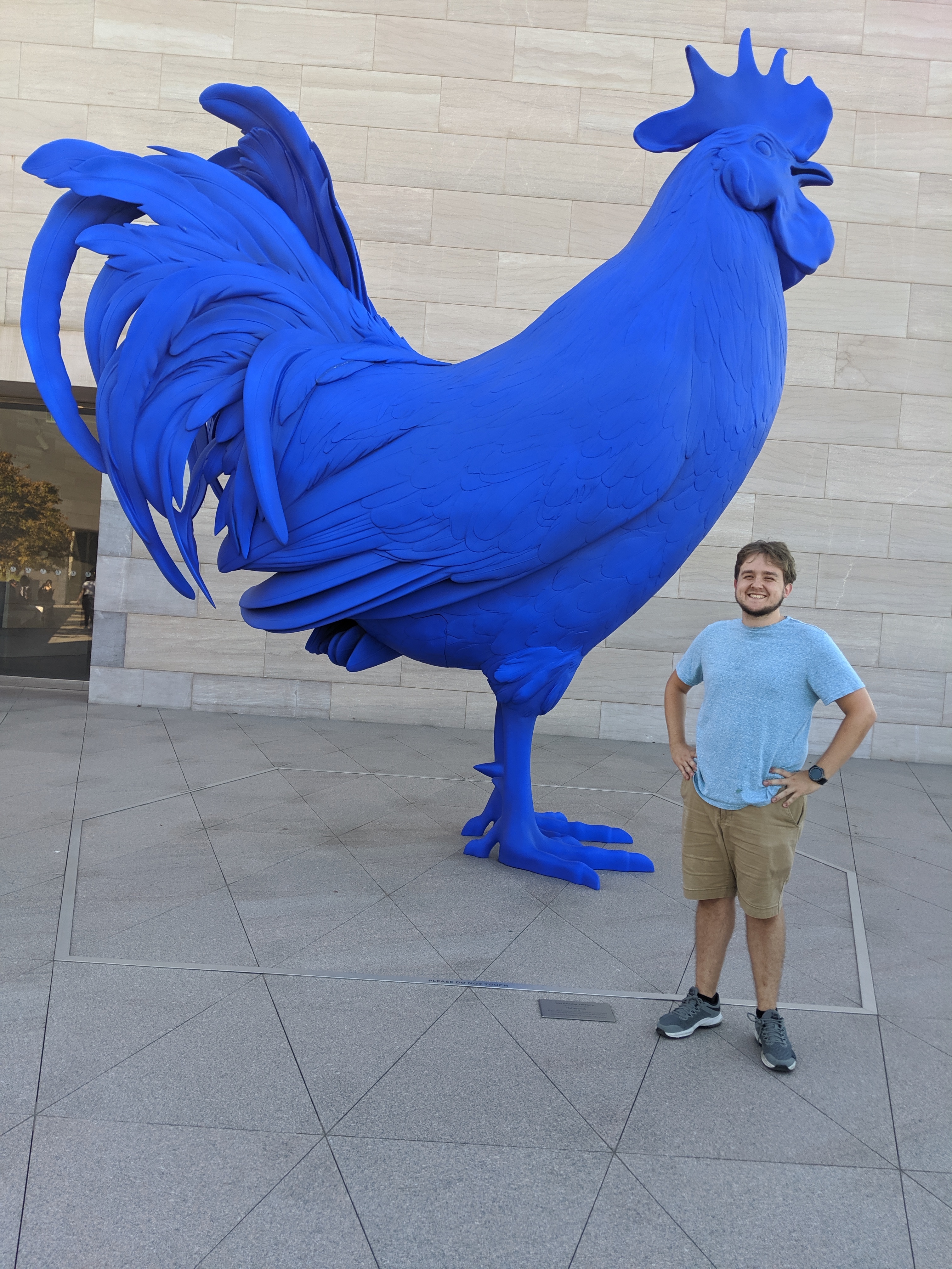 Me (right) with a large blue rooster Me (right) with a large blue rooster